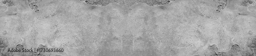 Photos A rugged gray concrete wall texture providing an industrial, aged backdrop suitable for design, branding, and editorial visuals