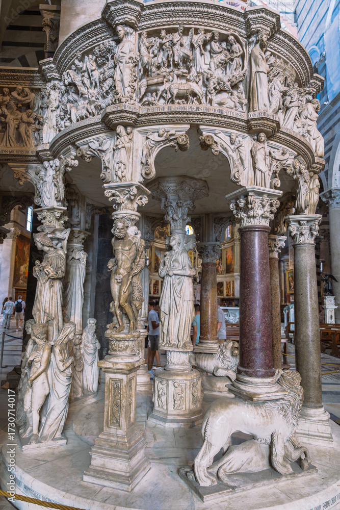 Fototapeta premium Ornate pulpit with sculpted figures and columns, exemplifying intricate craftsmanship in architecture and artistic design.