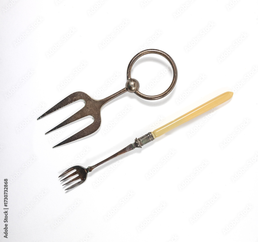 Fototapeta premium Vintage silver pickle forks isolated on white background