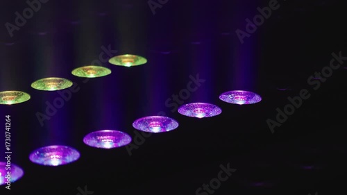 Vibrant RGB stage lights casting dynamic beams in multiple colors, creating an electrifying atmosphere perfect for concerts, festivals, and night events with immersive illumination.