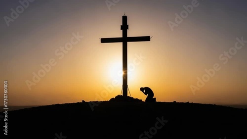 Silhouette of person praying near cross at sunset capturing religious faith. Religious faith in silhouette emphasizes devotion and seeking spiritual guidance.