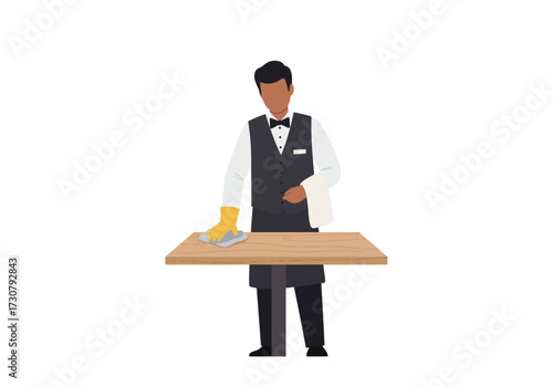 A waiter wipes a table in uniform