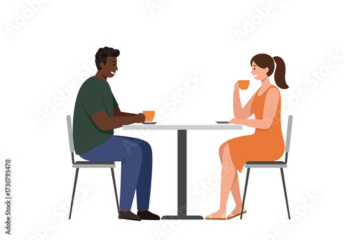 Two people drinking coffee at a table indoors