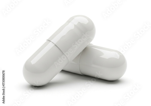 Two white medical capsules isolated on white background