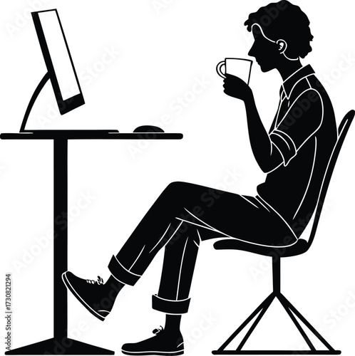 Man drinking coffee at computer silhouette