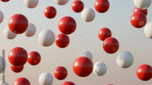 Abstract background with falling 3D objects. Simple red and white ball motion texture concept. Seamless loop.