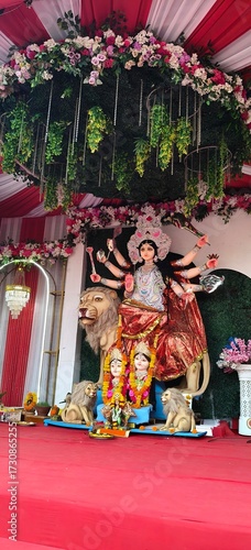 Idol of Goddess Devi Durga at a decorated puja pandal , Durga Puja is a famous and major religious traditional festival of Hinduism that is celebrated throughout the world.

