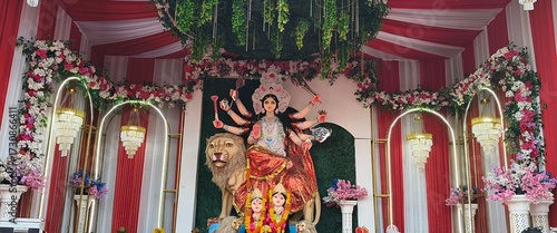 Idol of Goddess Devi Durga at a decorated puja pandal , Durga Puja is a famous and major religious traditional festival of Hinduism that is celebrated throughout the world.
