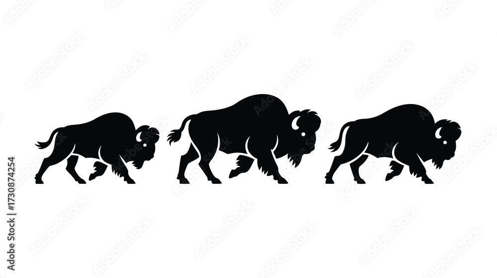 Naklejka premium Silhouette of three bison in motion across a field