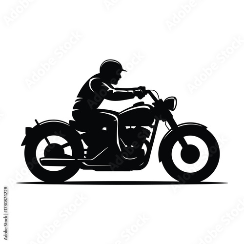Silhouette of a rider on a classic motorcycle in motion
