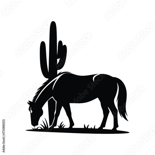 Desert horse silhouette grazing by a saguaro cactus at sunset
