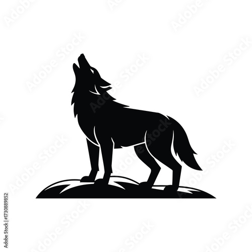Dramatic silhouette of a wolf howling at the moon on rocky terrain