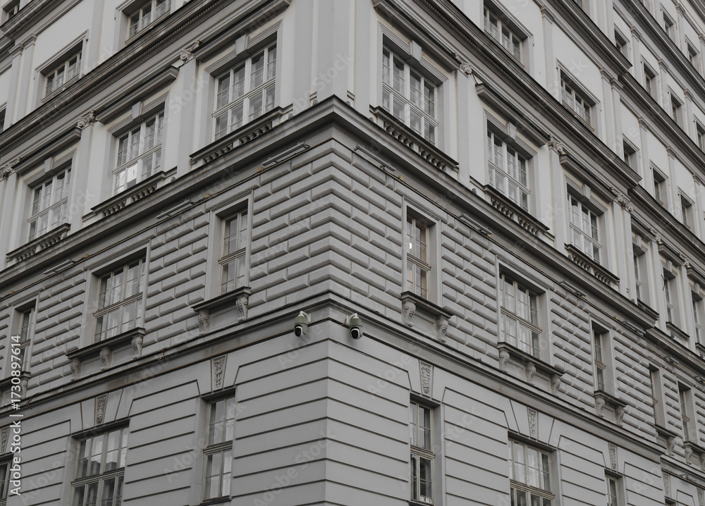 Obraz premium architecture background of angle view of administrative historic grey gray blue government building in downtown Belgrade. video surveillance