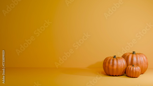 Pumpkins on a orange background, autumn and Halloween decorations