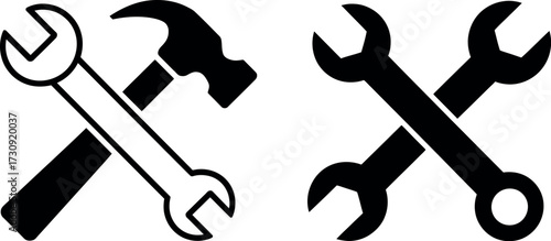 Two sets of crossed tools, a hammer and wrenches, symbolizing repair and construction.