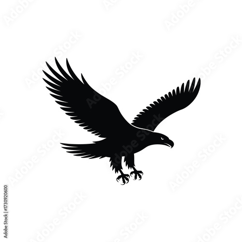 Majestic black silhouette of an eagle in mid-flight with wings spread wide