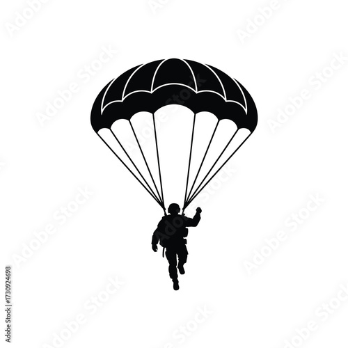 Silhouette of a skydiver descending gracefully under a full parachute harness