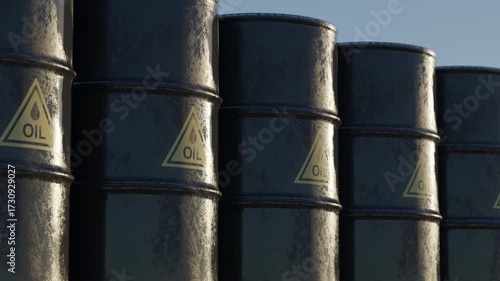 Row of black oil barrels with warning symbols under dramatic sky. Concept of global energy shortage, fuel crisis, dependence on fossil fuels and growing oil prices.