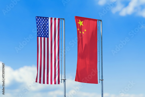 United States and China national flags waving on tall poles against blue sky, international relations and diplomacy concept.