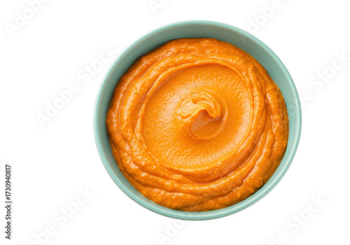 Vibrant orange pumpkin puree in a bowl isolated on transparent background, healthy food concept for cooking and baby food