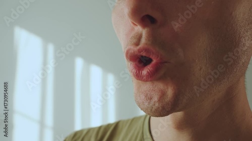 A man whistles with his lips, a man's whistle