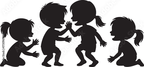 Four children silhouettes playing together with one pair high-fiving kids