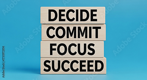 Wallpaper Mural Wooden blocks stacked high displaying the words decide commit focus and succeed on a blue background Torontodigital.ca