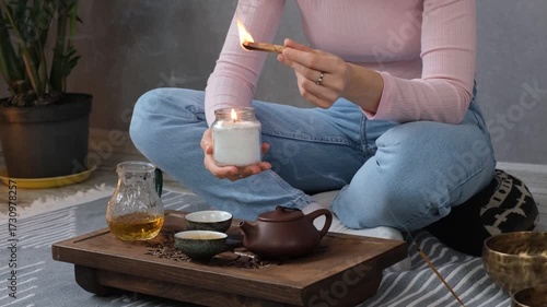 Woman lighting incense for meditation and spiritual practice
