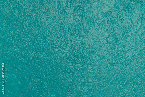 Obraz na płótnie Detalle frontal de muro mexicano pintado de color turquesa vibrante, textura