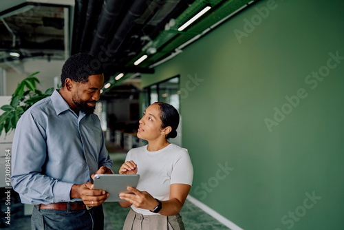 Quadro su tela Diverse business professionals collaborating in a modern office, one person show