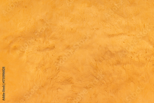 Schilderij op canvas Detalle frontal de muro mexicano pintado de color amarillo vibrante, textura