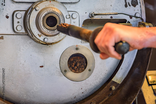 Quadro su tela Coffee roaster checks fresh beans with a sampling probe in Zurich, Switzerland