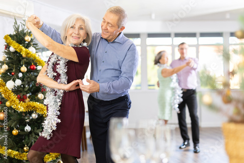 Photography At New Years party for studio students, elderly couple performs lindy hop dance