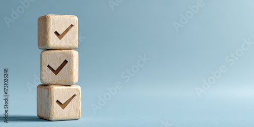 Three light beige wooden cubes stacked vertically, each with a checkmark symbol.  A pale, light-blue background creates a minimalist, clean aesthetic