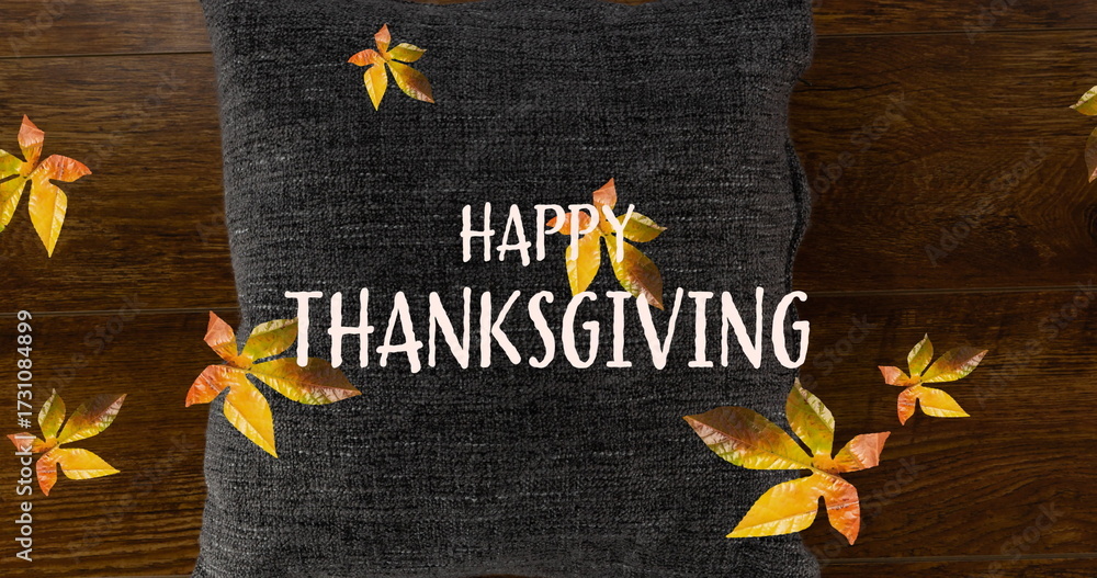 Fototapeta premium Image of happy thanksgiving text over fall leaves and pillow
