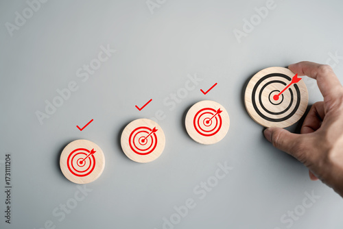 Goal achievement and milestone with targets from small to large, strategic planning, growth steps, productivity, business success, and accomplishment.