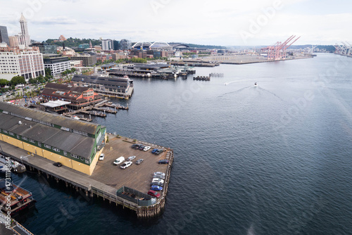 Aerial View of Seattle Waterfront, including Pier 55, Pier 58 and the Puget Sound as seen from above on an overcast summer day.