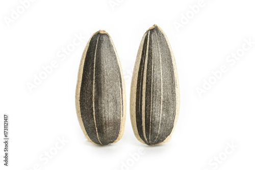 Two Sunflower Seeds with Black Striped Shells on White Background