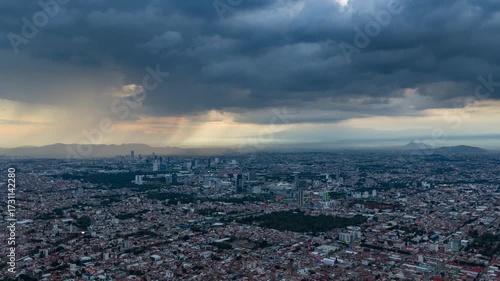 Aerial View of Puebla City at Sunset with Storm Clouds