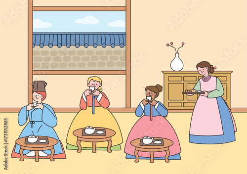 Foreign tourists in hanbok experience Korean tea ceremony inside a traditional hanok house.