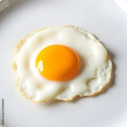 Fried egg on white plate isolated on white background, breakfast concept