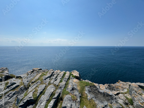 Stone ledge over dark blue ocean