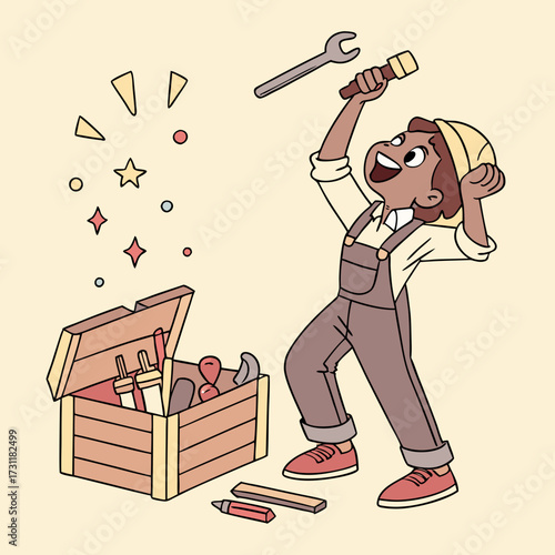 Joyful child in overalls and hard hat celebrating with a wrench and toolbox