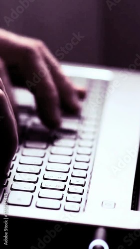 hands typing on a keyboard