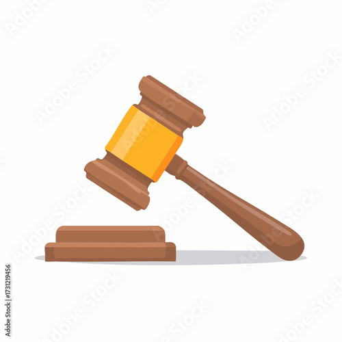 Wooden judge gavel with a yellow band resting on a wooden sound block, symbolizing law and justice