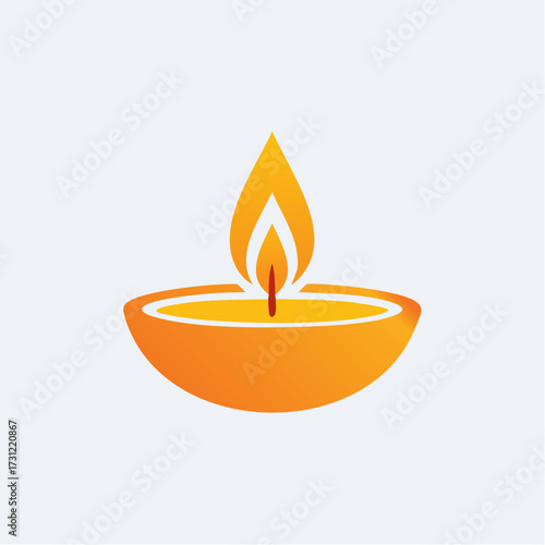 A glowing orange oil lamp with a flickering flame symbolizing light, warmth, and traditional celebration