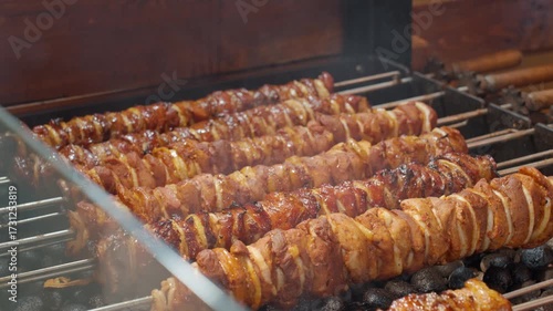 Wallpaper Mural Close-up of grilled meat skewers with onion cooking on hot charcoal grill. Concept of street food, barbecue, traditional festival cuisine and outdoor cooking Torontodigital.ca