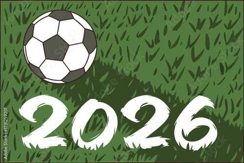 Soccer ball on green grass with white year 2026 text football