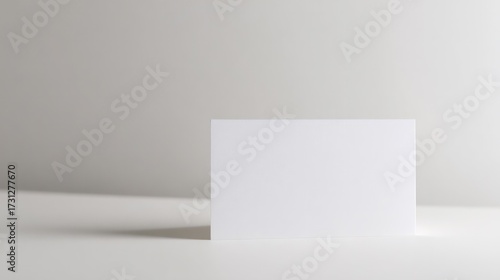 Minimalist stationery business card showcasing elegant logo design on white background.