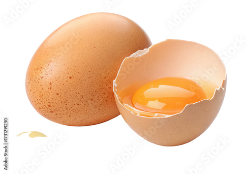 Fresh brown eggs with cracked shell and vibrant yolk for nutritious breakfast ingredients concept